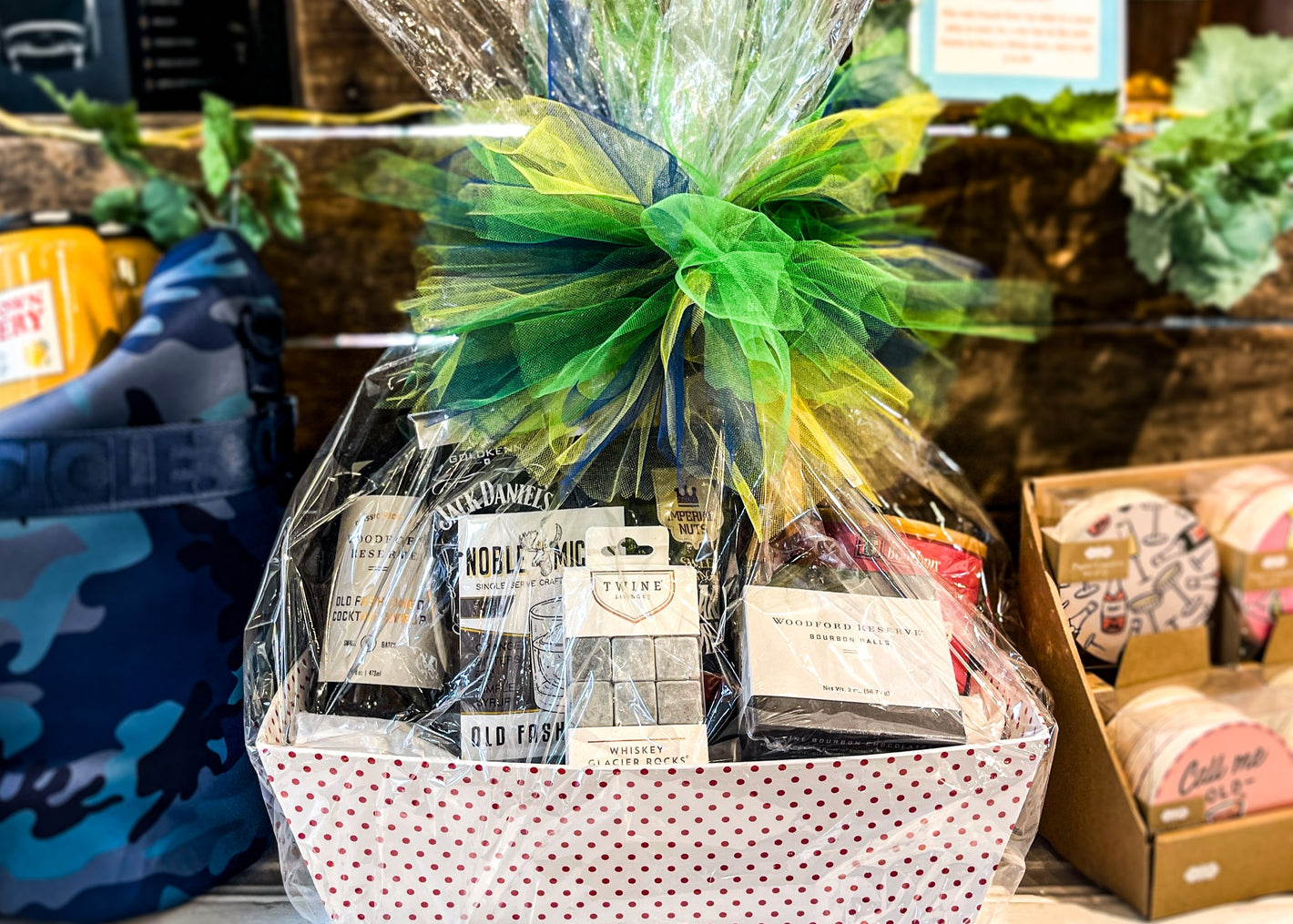 Gift basket with bottles and snacks in a store setting